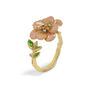 An adjustable ring featuring a pink flower painted with enamel.